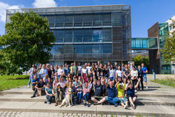 Group of happy people in front of the MPI for Biology Tübingen building